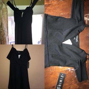 Off the Shoulder black mini dress; with low dip